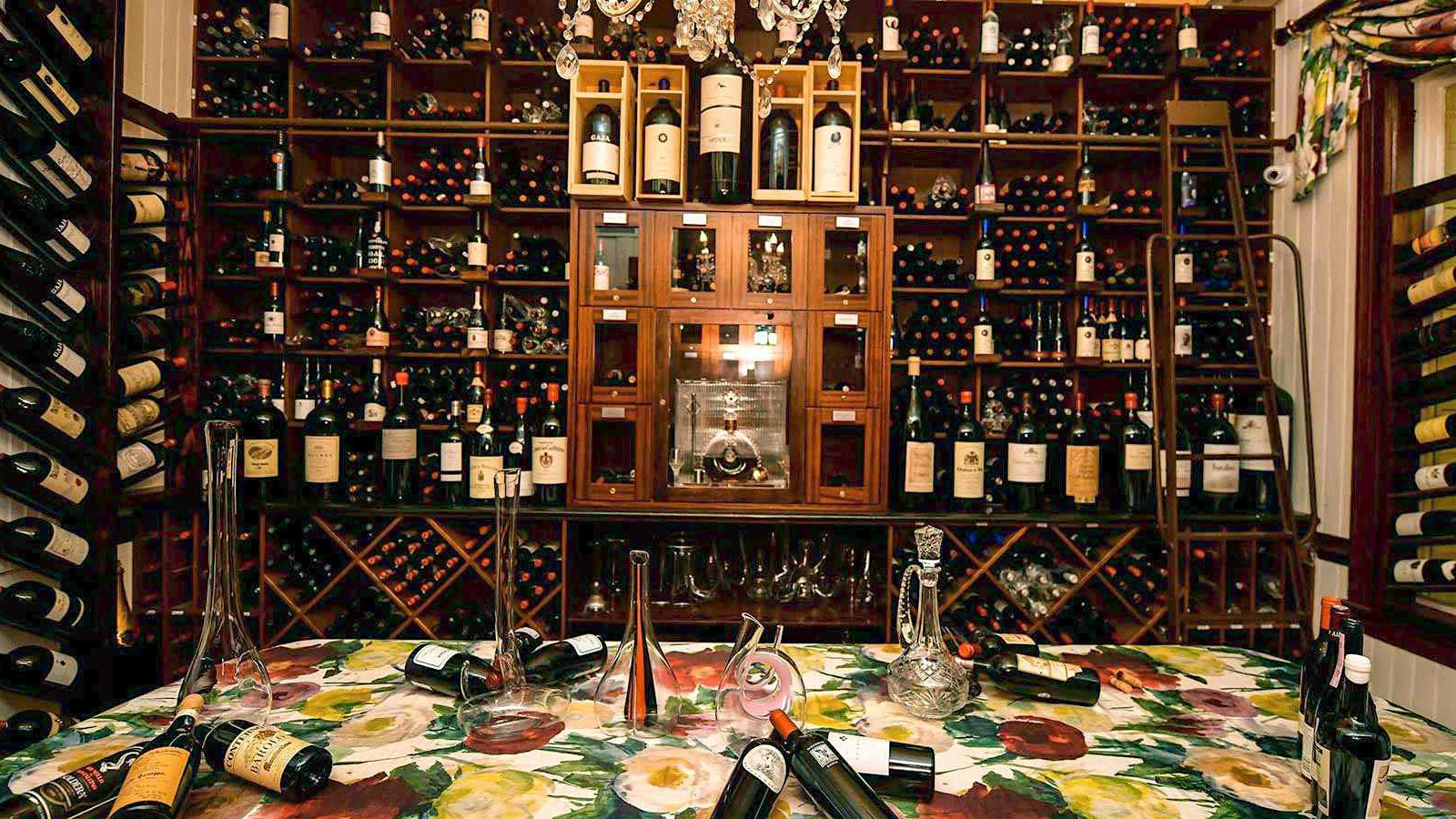 Bottles of wine on shelves at Grand Old House